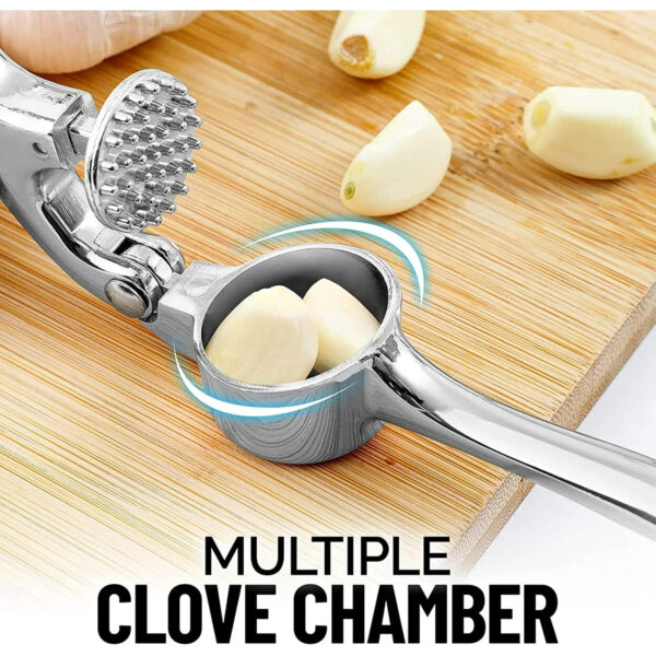 Using garlic mincer to crush fresh ginger pieces easily