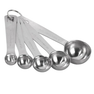 Stainless steel measuring spoon with 15ml capacity placed on white background